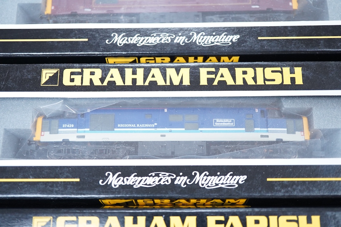 Three boxed Graham Farish N gauge railway Class 37/4 Co-Co diesel-electric locomotives; a Scottish EWS, Loch Awe (371151), a Regional Railways, Eisteddfod Genedlaethol 37429 (371154), and an EWS, 37419 (371153).